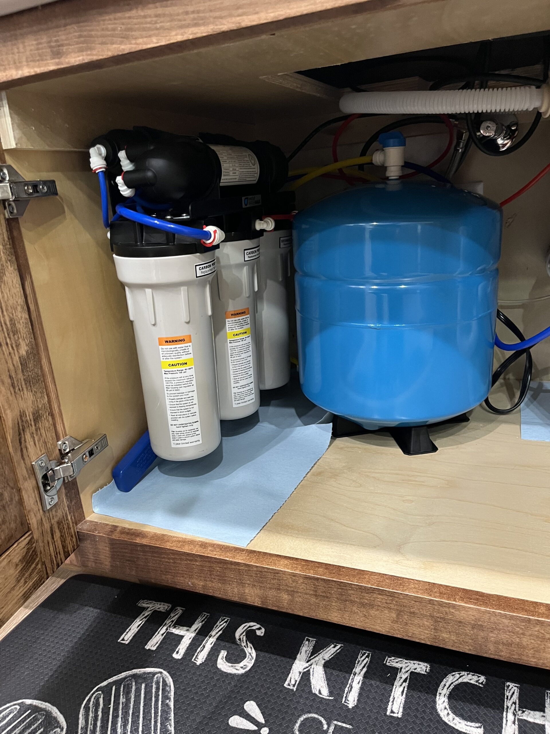Reverse osmosis system installed underneath a kitchen sink